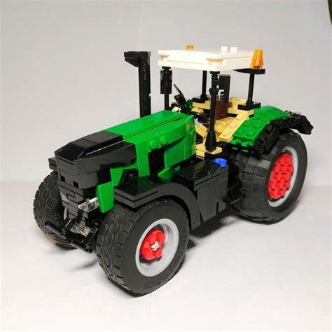 Lego tractor moc - The tractor is a RC Mod of the Lego 9393 tractor in red. Of course you can build it in lime, but I just had the red part to build it and now I like it better than the lime :) I added a Digger; it can be lifted up and down and the bucket can be tilted. I used the thin gears with 20 gears to make the lifting faster, but during steering the front ...